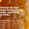 A collection of various raw UK honey jars including Scottish Heather, Wildflower Blend, and Buckwheat on a rustic wooden table with lavender, chamomile, and a honey dipper.