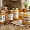A collection of various raw UK honey jars including Scottish Heather, Wildflower Blend, and Buckwheat on a rustic wooden table with lavender, chamomile, and a honey dipper.